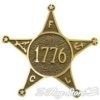 A star shaped badge with the words " 1 7 7 6 " on it.