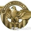 A gold eagle with the words world war two in it's center.