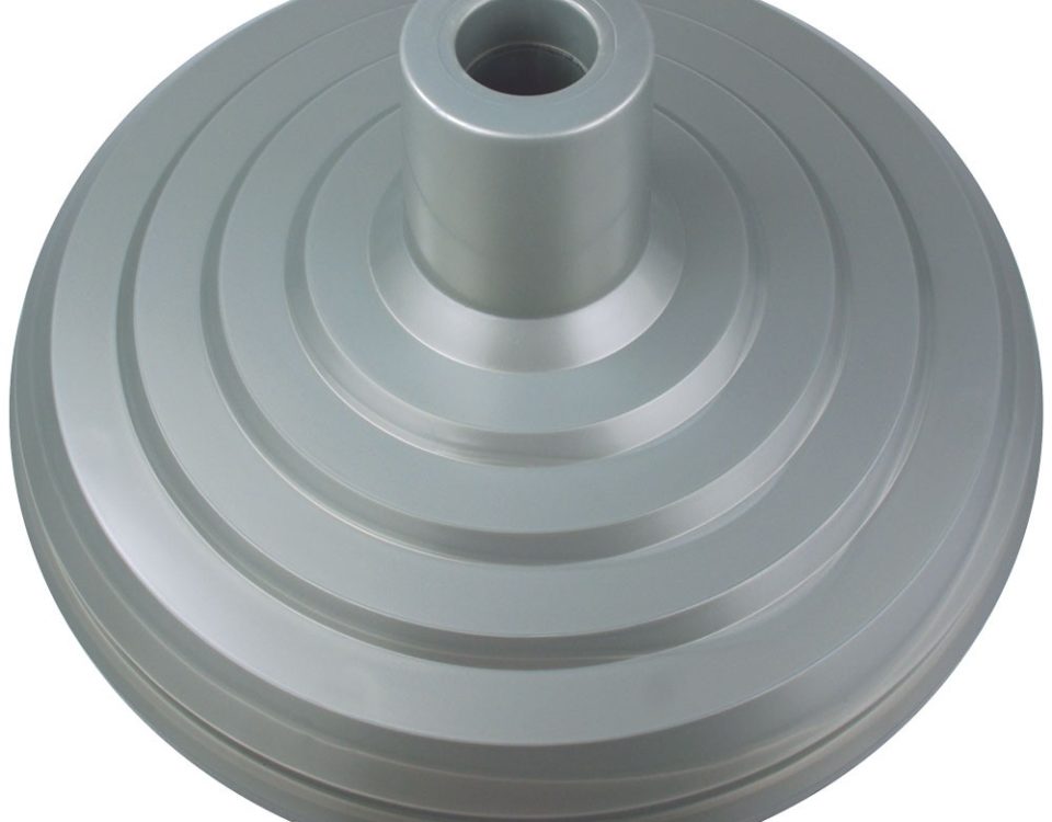 A silver metal object with a hole in the middle.