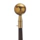 A gold ball on top of a wooden handle.
