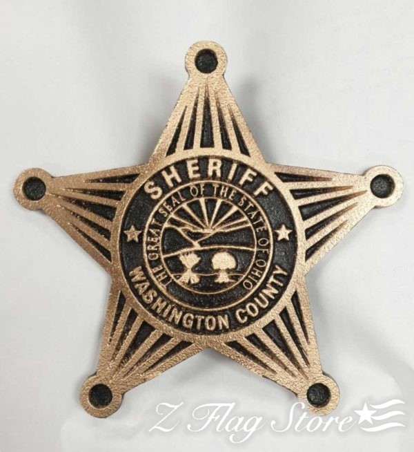 A wooden sheriff 's star with the washington county sheriffs department logo.